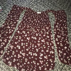 This is a dark maroon floral romper